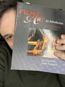 Me with my copy of Film Art: An Introduction, written by David Bordwell and Kristin Thompson.